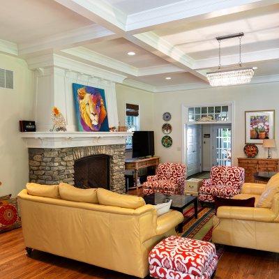 terrace park residential addition with stone fireplace and coffered ceiling